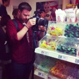 Arthur being way too serious for filming in a candy store!