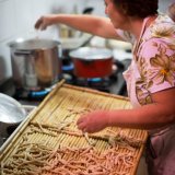 Woman preparing pasta at the masseria