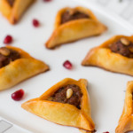 Triangle Fingerfood with merguez and pomegranate seeds